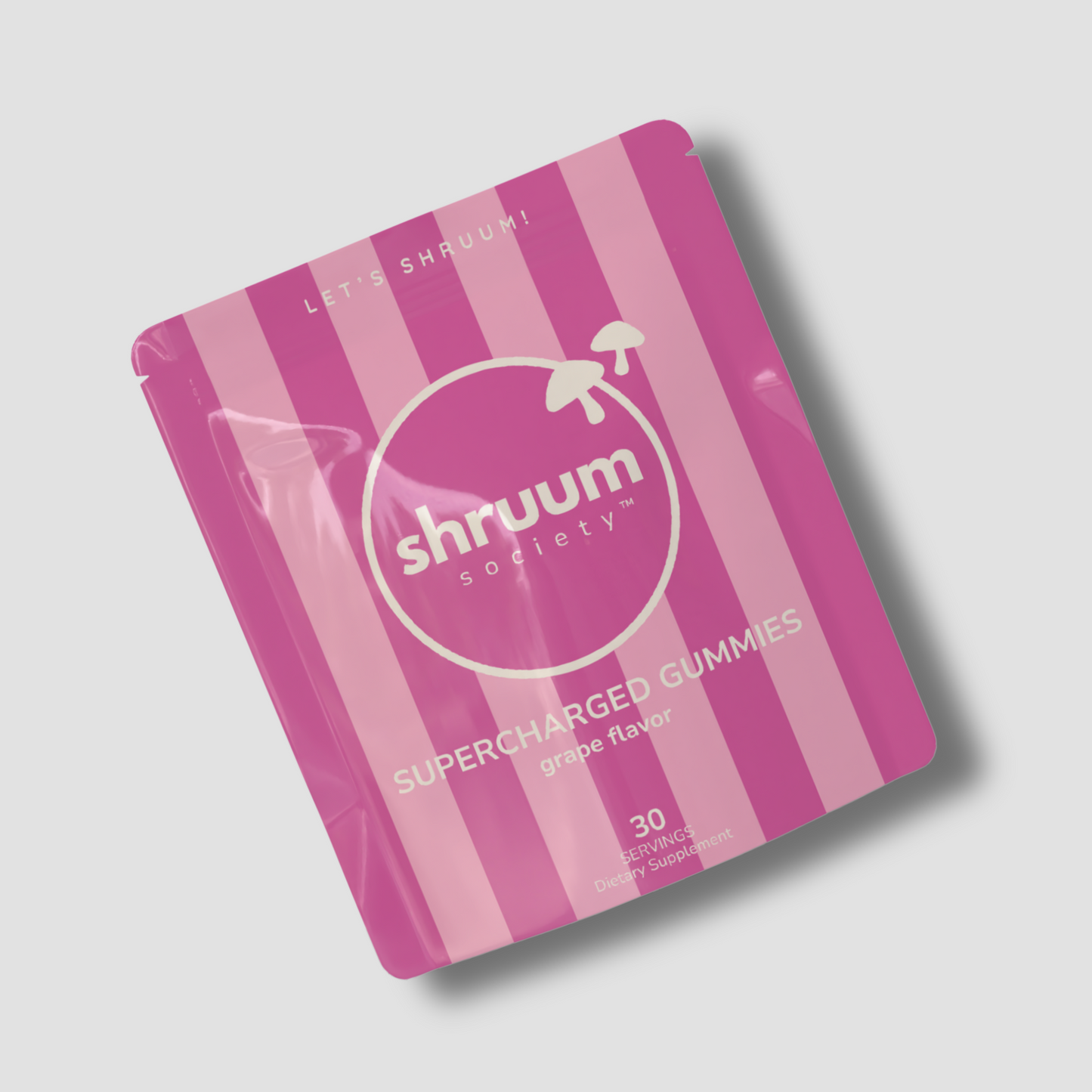 Pink and white package of Shruum Society supercharged gummies on a light gray background