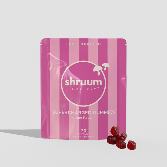Pink striped package of shruum society supercharged gummies on a white background
